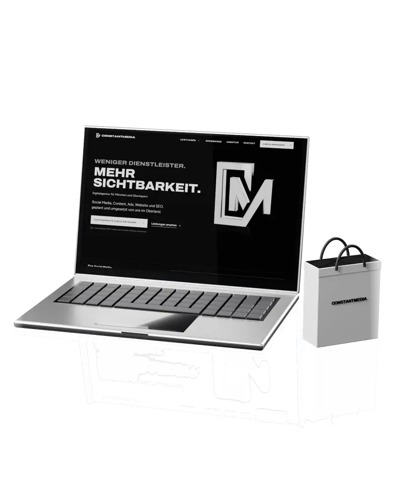 Aufgeklappter Laptop mit einer Website auf dem Bildschirm, daneben eine Einkaufstasche (Symbolbild für Websites und Onlineshops)